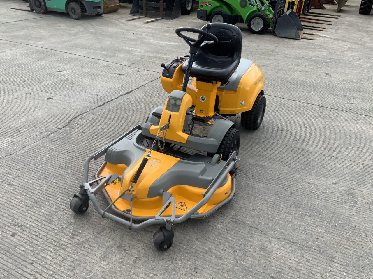 Compact tractor working on a small farm